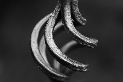 Close-up of rope against black background