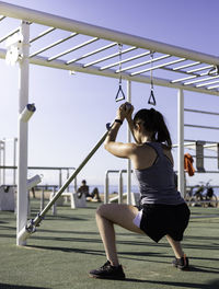 Full length of woman exercising outdoors