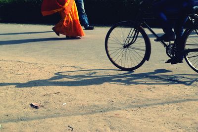 Low section of man with bicycle