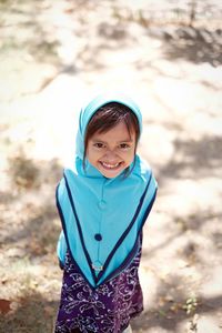 Portrait of girl standing on field