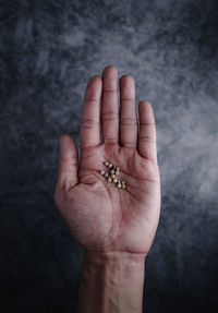 Close-up of prpper corn on hand