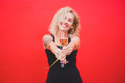 Full length of a woman drinking glass