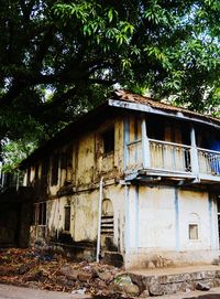 Abandoned house against trees