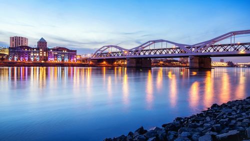 Illuminated bridge over river