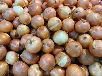 Full frame shot of onions for sale at market stall