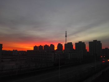 Cityscape against sky during sunset