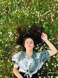 Portrait of woman standing against plants