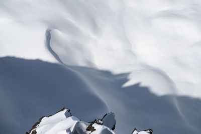 Low angle view of snowcapped mountain against sky