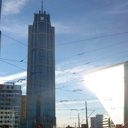 Low angle view of building against cloudy sky