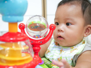 Close-up portrait of cute baby toy