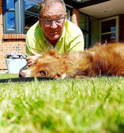 Man with dog on grass