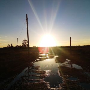 Scenic view of road against sky during sunset