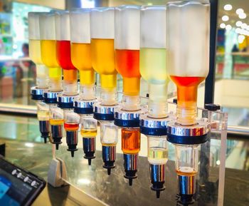 Close-up of multi colored glass on table