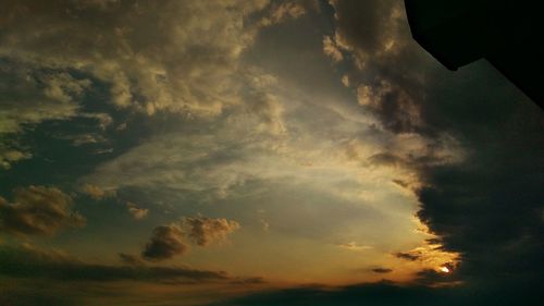 Low angle view of dramatic sky during sunset