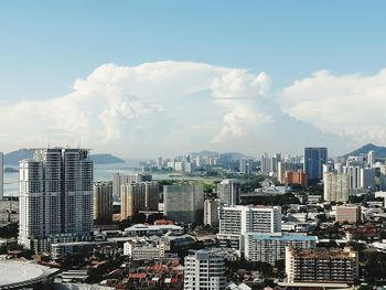 Modern buildings in city against sky