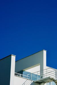 Low angle view of building against clear blue sky