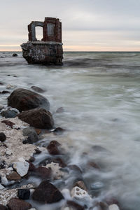 Scenic view of sea against sky at sunset