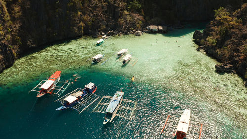 Tourist boats around the beautiful big and small lagoons, aerial view. l