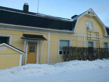 House against sky during winter