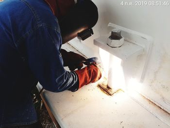 High angle view of man working on table