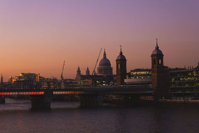 View of bridge over river at sunset