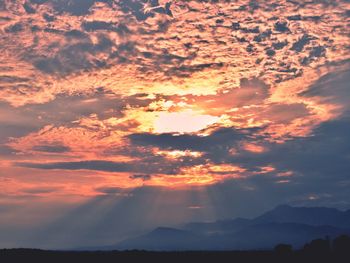 Low angle view of silhouette mountain against sky during sunset