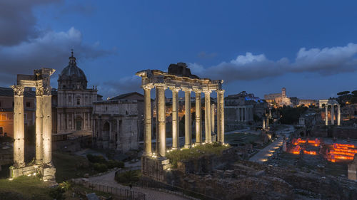 Roman forum in city at dusk