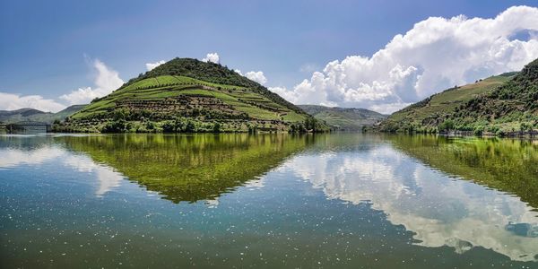 Panoramic view of lake and mountains against sky