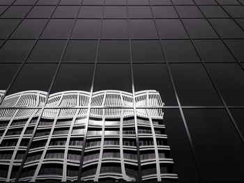 Close-up of building reflection on glass of another building