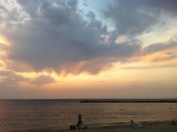 Scenic view of sea against cloudy sky