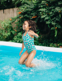 Young woman swimming in pool