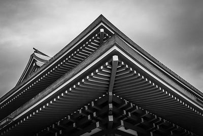 Low angel view of pagoda against cloudy sky