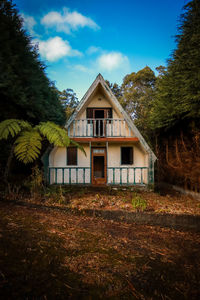 House on field against sky