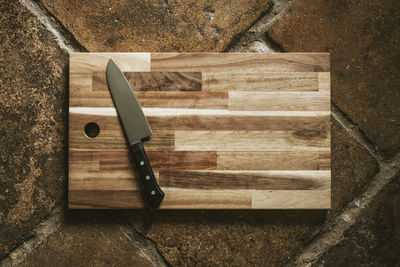 Directly above shot of knife over cutting board