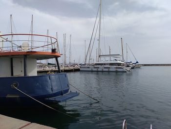 Boats moored at harbor