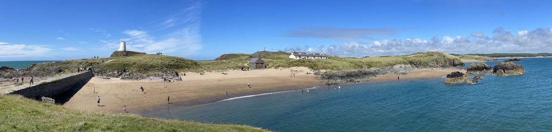 Panoramic view of beach against blue sky