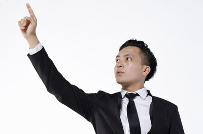 Low angle view of man against white background