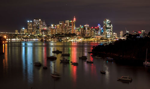 Illuminated city at waterfront