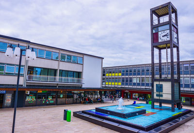 View of swimming pool against buildings in city