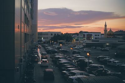 Aerial view of city against sky during sunset