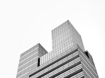Low angle view of modern buildings against clear sky