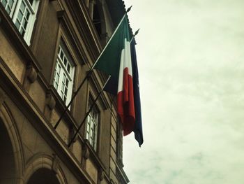 Low angle view of flag against sky