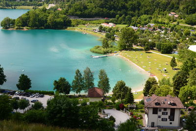 High angle view of buildings by sea against sky