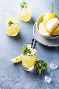 Close-up of fruits and drink on table