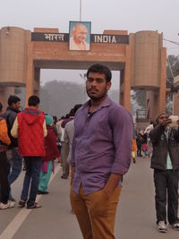 Men standing in city