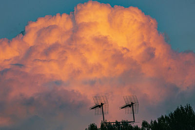 Low angle view of silhouette trees against sky during sunset