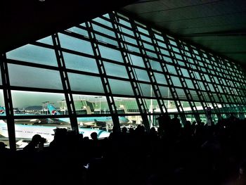 Glass structure against sky