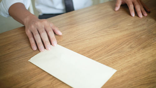 High angle view of woman working on table