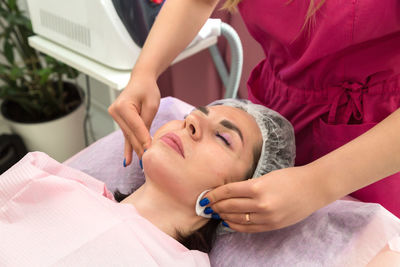 Midsection of doctor examining patient