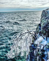 Close-up of frozen sea against sky